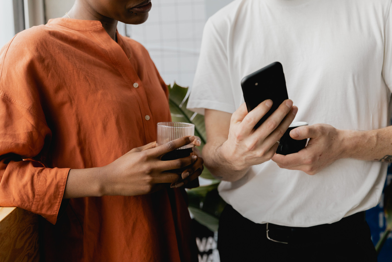 Two friends looking at a phone together
